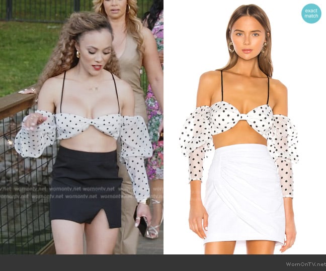 Ashley’s polka dot cold shoulder top on RHOP