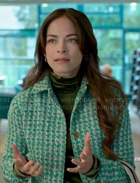 Cassandra's green velvet top and tweed jacket on Murder in a Small Town