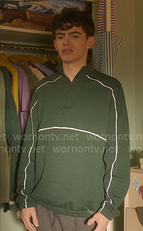 Charlie's green pullover with white piping on Heartstopper