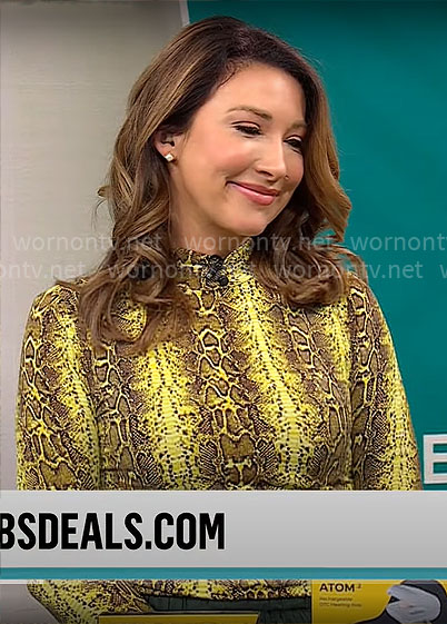 Courtney Cason's yellow snake print top on CBS Mornings