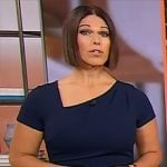 Dana Jacobson’s navy asymmetric neckline dress on CBS Mornings