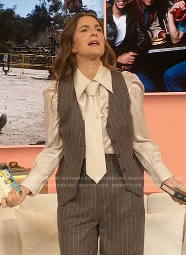 Drew's white jacquard blouse and grey pinstripe vest on The Drew Barrymore Show