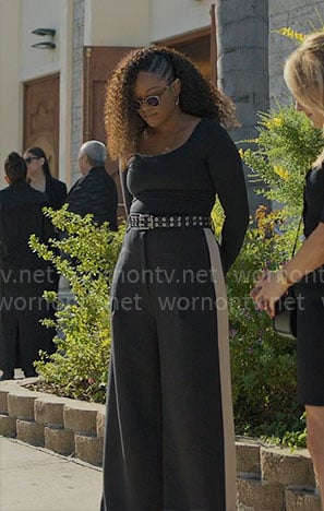 Izzy’s black wide leg pants with side stripe on The Lincoln Lawyer