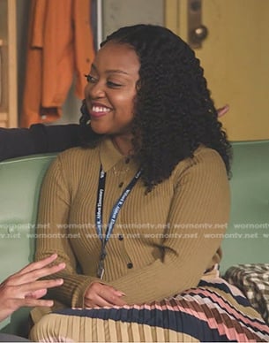 Janine's camel ribbed knit shirt and striped pleated skirt on Abbott Elementary