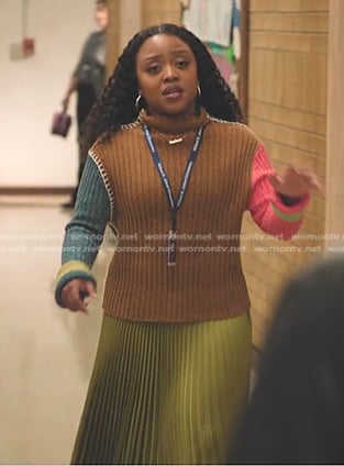 Janine's brown colorblock ribbed sweater and yellow pleated skirt on Abbott Elementary