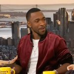 Jay Pharoah’s burgundy velvet bomber jacket on The Drew Barrymore Show