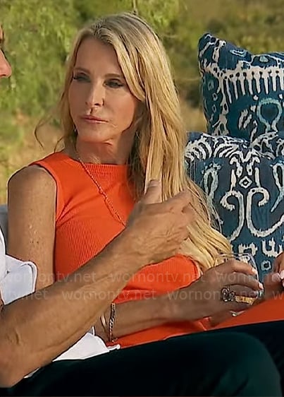 Joan's orange rib knit midi dress with back cutout on The Golden Bachelorette