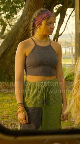 Kiara's grey tank top and green patchwork pants on Outer Banks