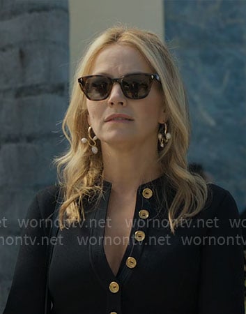 Lorna's black mini dress with gold buttons on The Lincoln Lawyer