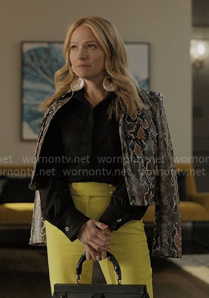 Lorna’s snake jacket, yellow pants and shell earrings on The Lincoln Lawyer