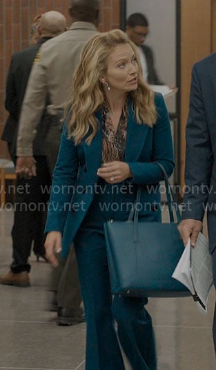 Lorna’s teal suit with printed blouse on The Lincoln Lawyer