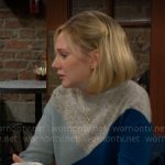 Lucy’s blue colorblock sweater on The Young and the Restless