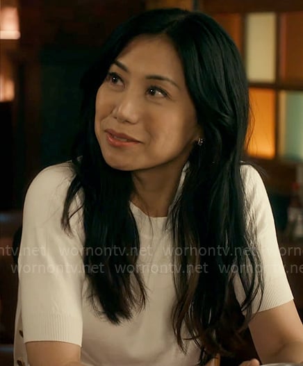 Mel’s white short-sleeve sweater on The Equalizer