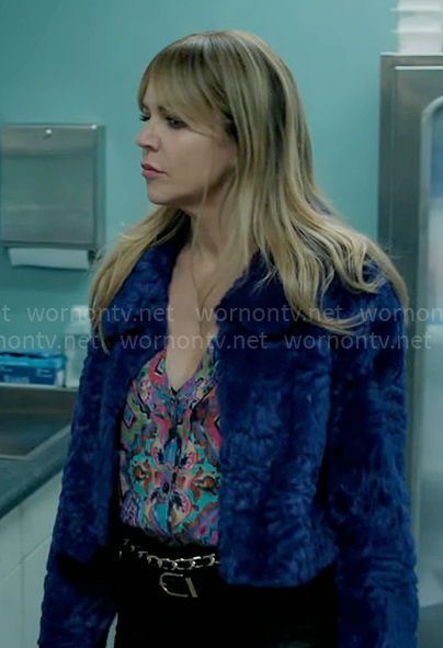 Morgan's colorful printed blouse and blue fur jacket on High Potential