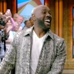 Morris Chestnut’s gray snake skin print jacket on Live with Kelly and Mark