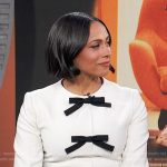 Nicolette Robinson’s white contrast bow dress on E! News