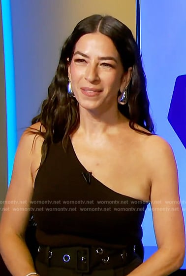 Rebecca Minkoff’s black one-shoulder top and belted pants on E! News