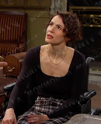 Sarah's black top and plaid pants on Days of our Lives