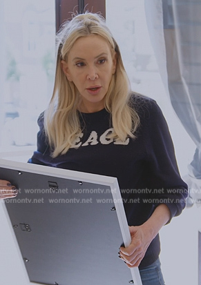 Shannon’s black peace sweater on The Real Housewives of Orange County