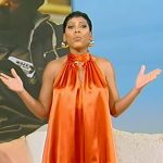 Tamron’s orange sleeveless ruffle hem dress on Tamron Hall Show