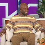 Akbar’s brown and yellow striped sweater on The Talk