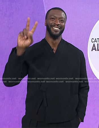 Aldis Hodge's black wrap shirt and pants on Today