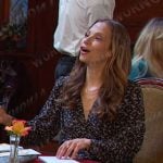 Ava’s black print v-neck blouse on Days of our Lives