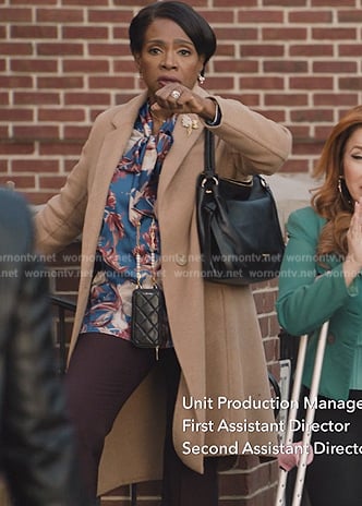 Barbara's blue floral print tie neck blouse on Abbott Elementary