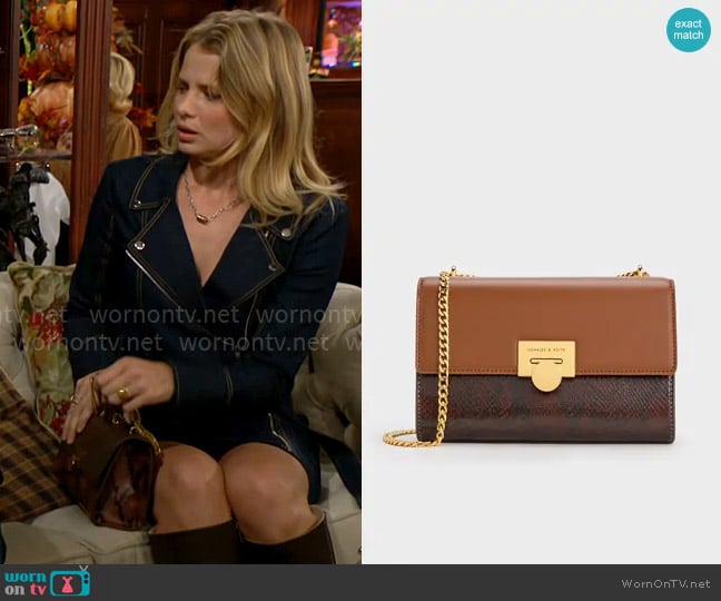 Charles & Keith Snake Print Chain-Strap Bag in Chocolate worn by Summer Newman (Allison Lanier) on The Young and the Restless