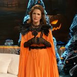 Drew’s orange ruffle hem dress on The Drew Barrymore Show