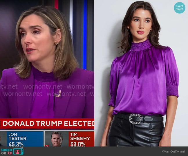 Elie Tahari Short Sleeve Silk Satin Smocked Shirt in Berry worn by Margaret Brennan on CBS Mornings