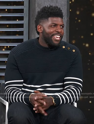 Emmanuel Acho’s navy stripe sweater on Access Hollywood