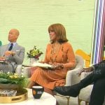 Gayle King’s orange rib knit pleated dress on CBS Mornings