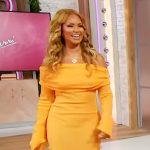 Gizelle Bryant’s orange off shoulder dress on Sherri