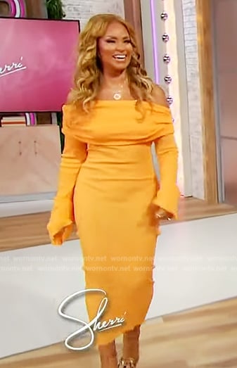 Gizelle Bryant's orange off shoulder dress on Sherri