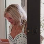 Jennifer’s white floral print sleeveless dress on The Real Housewives of Orange County