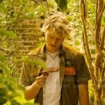 JJ’s stripe graphic tee and orange panel shirt on Outer Banks