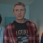 Johnny’s black graphic print tee and red plaid shirt on Cobra Kai