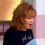 Joy’s navy embroidered sweater on The View