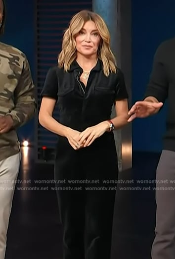 Kit's black velvet jumpsuit on Access Hollywood