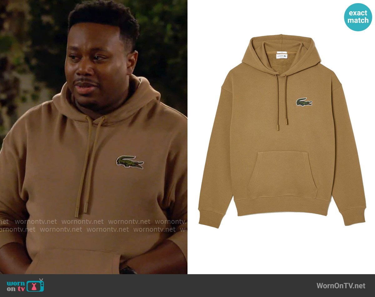 Lacoste Loose Fit Hooded Organic Cotton Sweatshirt In Brown worn by Marty (Marcel Spears) on The Neighborhood