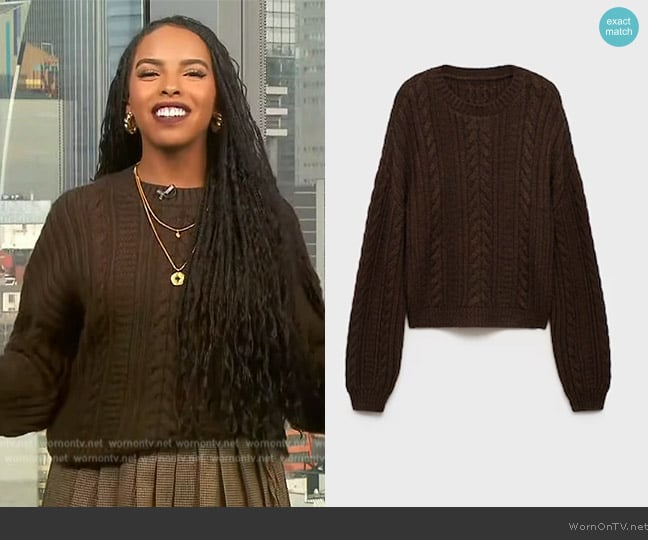 Mona’s brown cable knit sweater on Extra