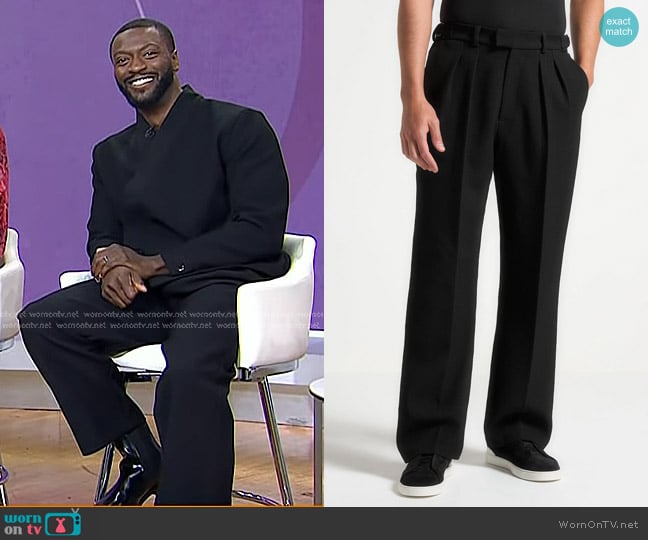 Manière De Voir Relaxed Fit Textured Twin Pleat Tailored Trousers in Black worn by Aldis Hodge on Today