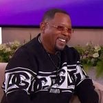 Martin Lawrence’s black logo sweater on The Jennifer Hudson Show