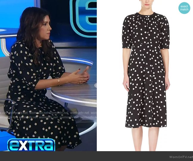 Camille’s black polka dot print dress on Extra