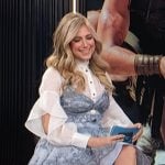 Nikki Novak’s white ruffle sleeve top and paisley print mini dress on E! News