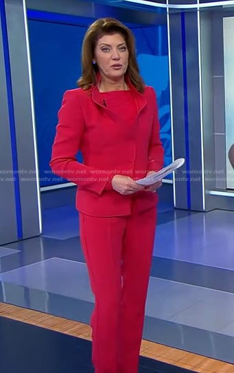 Norah's pink ruffled blazer and pants on CBS Evening News