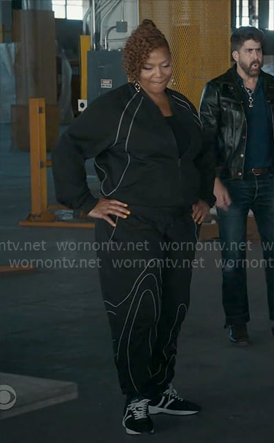 Robyn's black tracksuit with white piping on The Equalizer