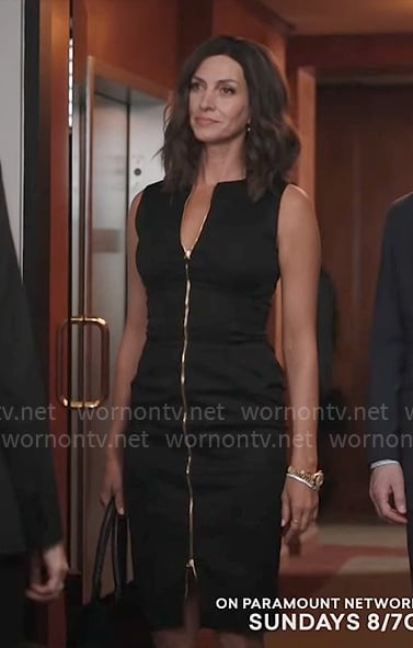 Sarah’s black zip-front dress and grommet trim bra on Yellowstone