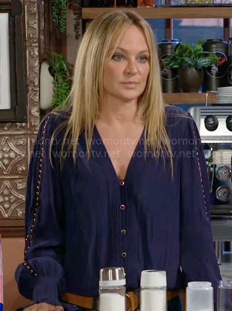 Sharon's navy v-neck blouse with stud insets on The Young and the Restless